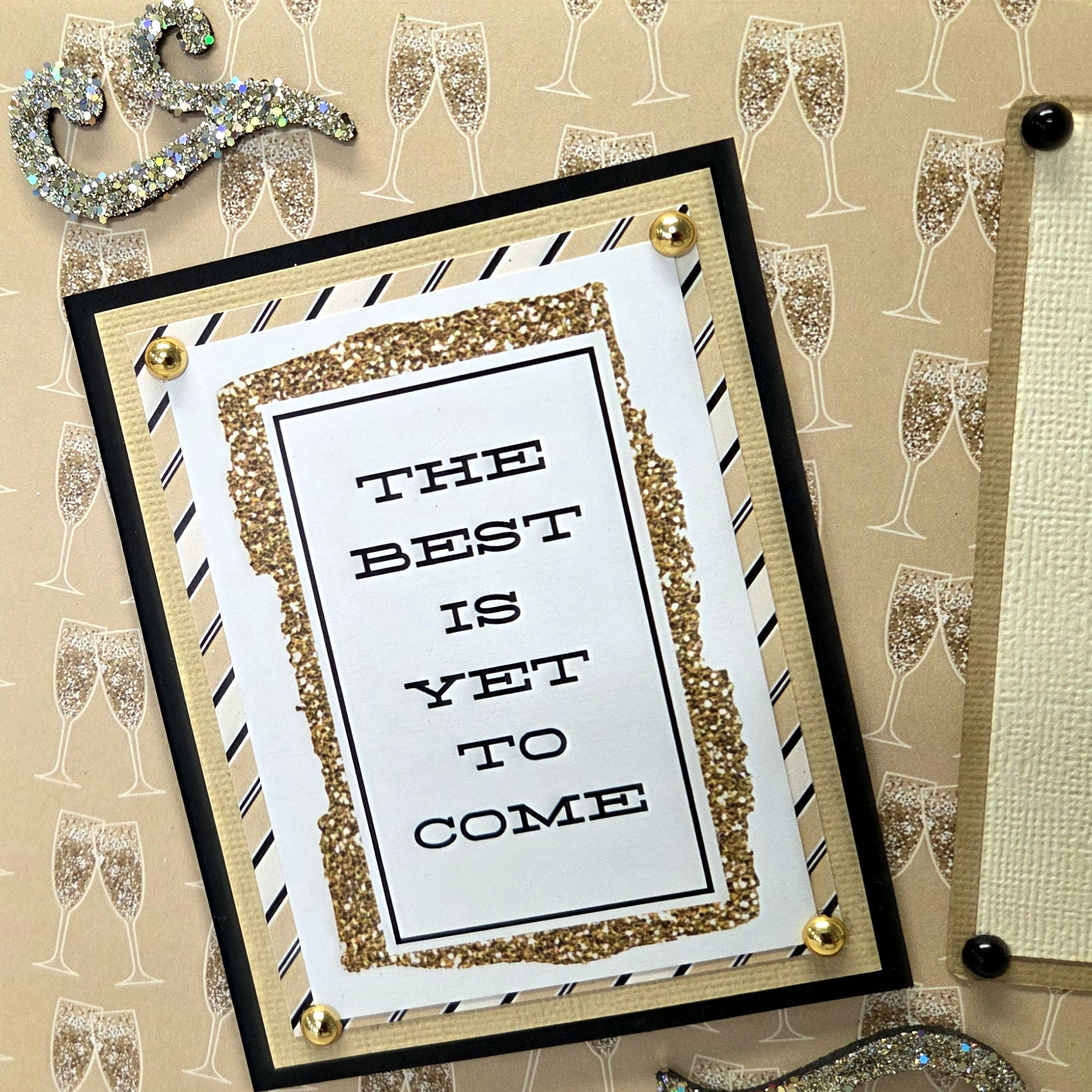 Decorative card with 'The best is yet to come' text on a patterned background